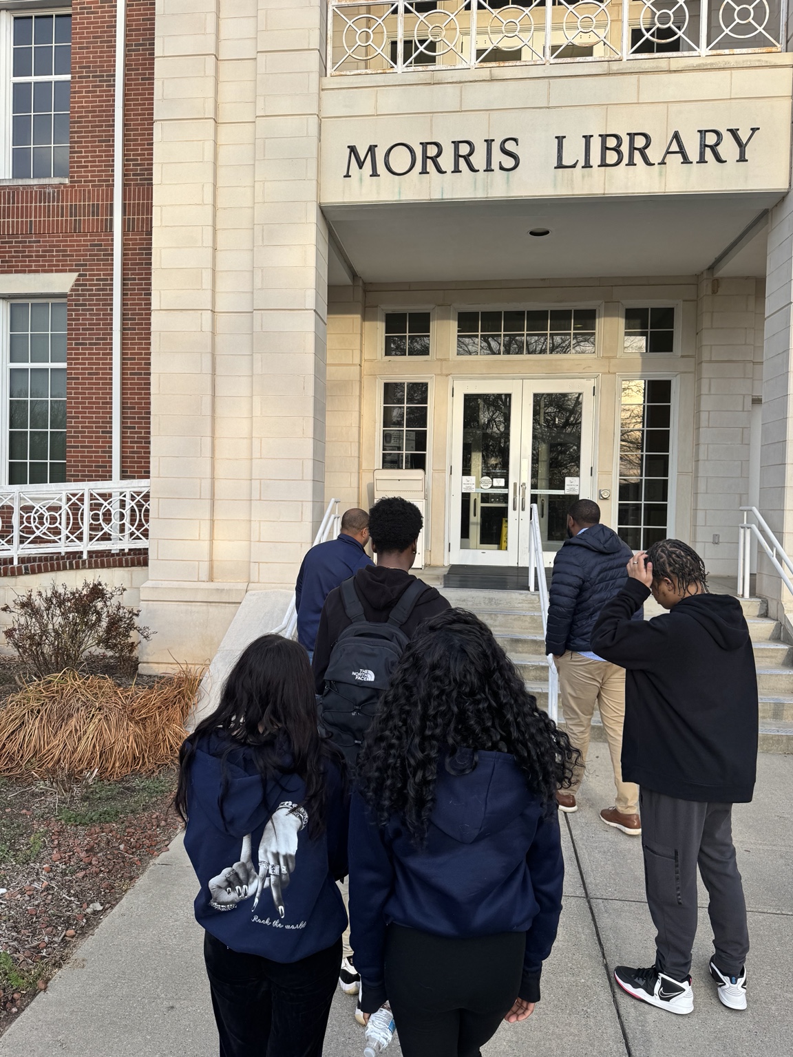 Breaking Away youth entering a college library during an educational visit