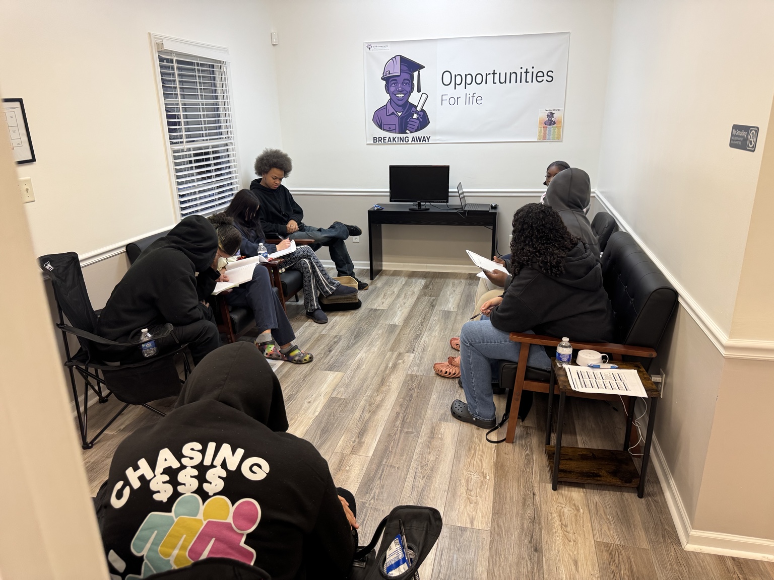 Breaking Away youth participating in a structured group mentoring session